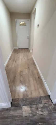 a view of kitchen and empty room