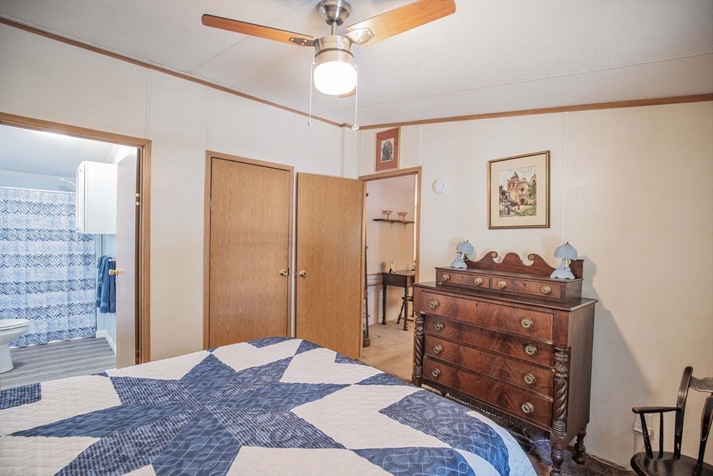 157 Scotland Road Newbury, MA 01951 - Photo 16 of 34 a bedroom with a bed and a dresser