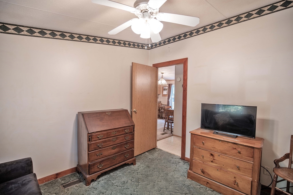 157 Scotland Road Newbury, MA 01951 - Photo 20 of 34 a room with a flat screen tv and a dresser