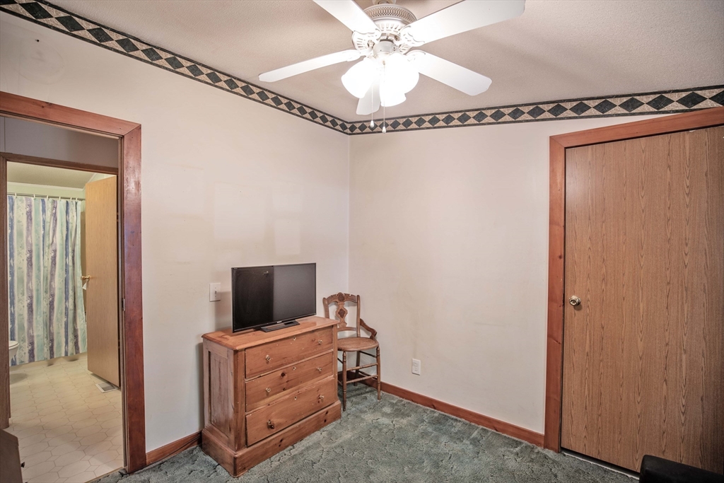 157 Scotland Road Newbury, MA 01951 - Photo 21 of 34 a living room with furniture and a flat screen tv