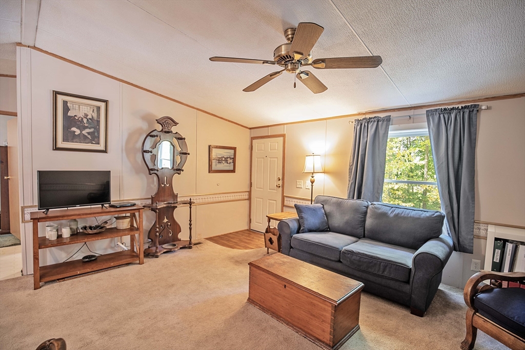 157 Scotland Road Newbury, MA 01951 - Photo 7 of 34 a living room with furniture and a flat screen tv