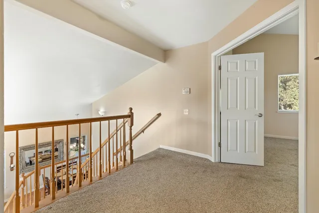 a bedroom with a bed and a night stand