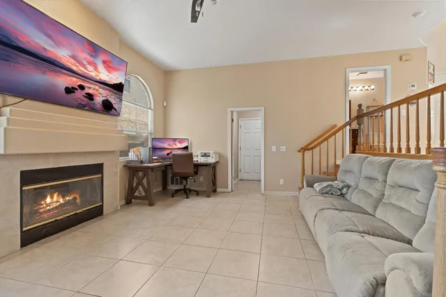 a living room with furniture and a fireplace