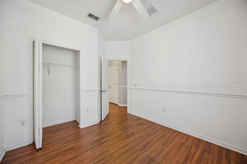 3140 Riachuelo Lane Kissimmee, FL 34744 - Photo 13 of 24 an empty room with wooden floor