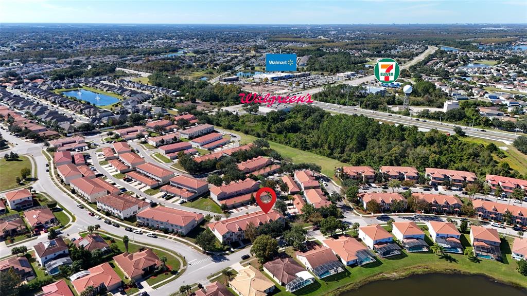 3140 Riachuelo Lane Kissimmee, FL 34744 - Photo 21 of 24 an aerial view of city parking and river