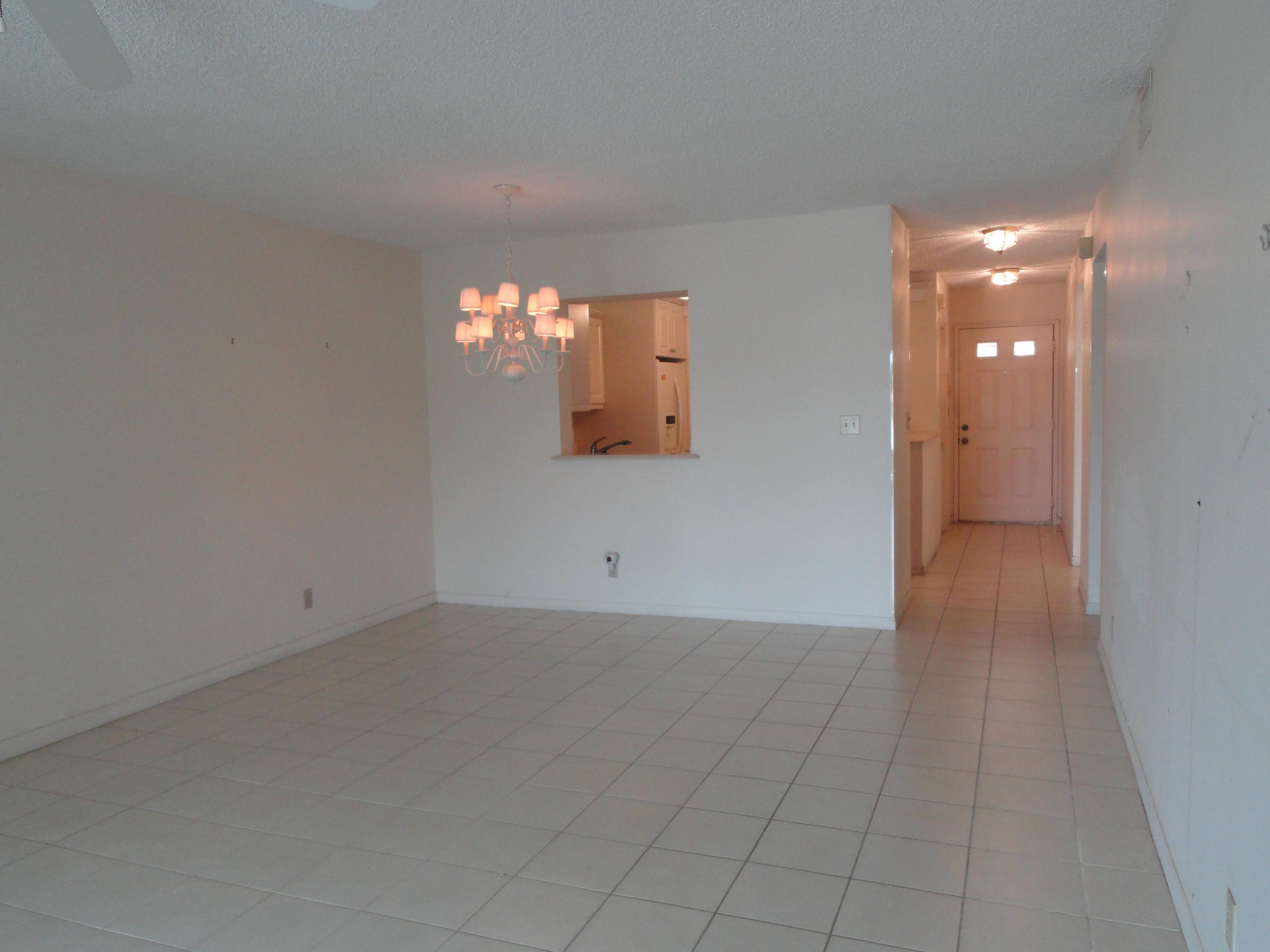 9111 Tracy Court, Unit 2 Boca Raton, FL 33496 - Photo 4 of 25 Dining Area with Pass Thru to Kitchen