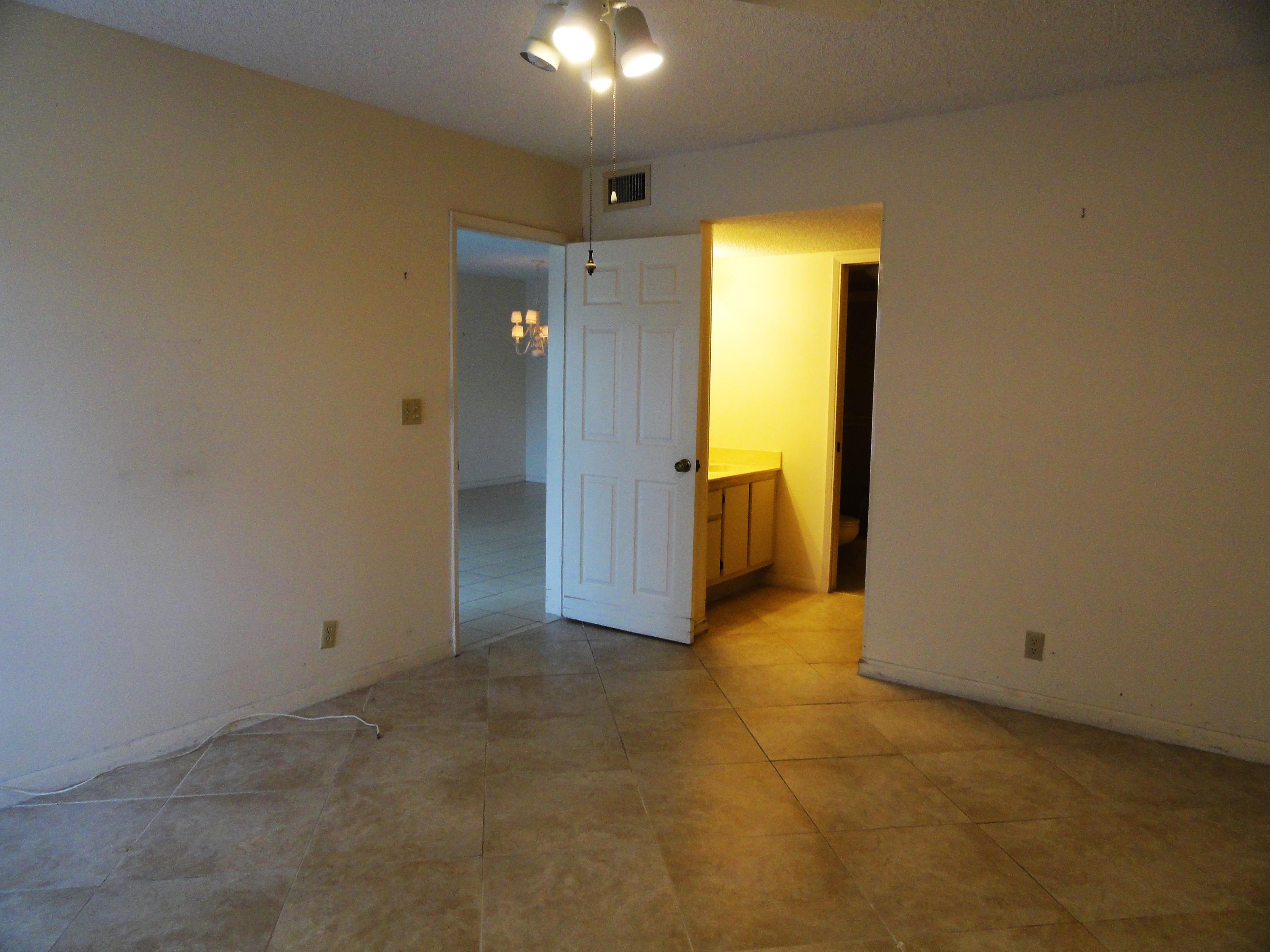 9111 Tracy Court, Unit 2 Boca Raton, FL 33496 - Photo 7 of 25 Master Bedroom