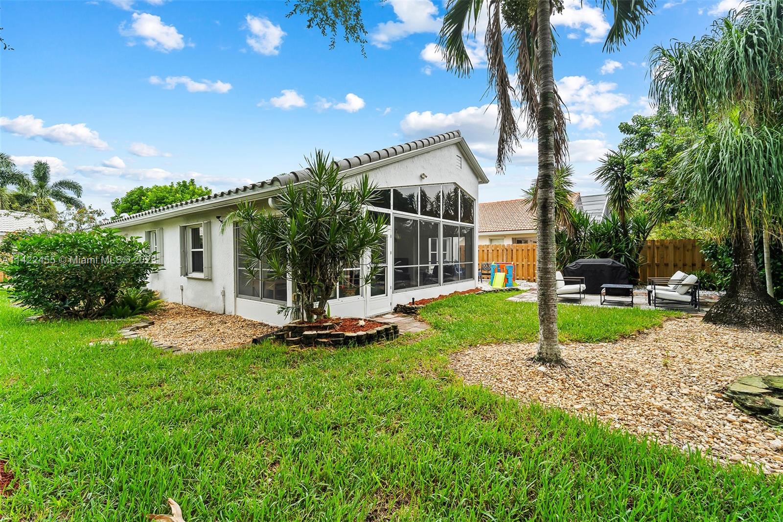 22699 Royal Crown Terrace East Boca Raton, FL 33433 - Photo 29 of 36 a view of a house with backyard porch and sitting area