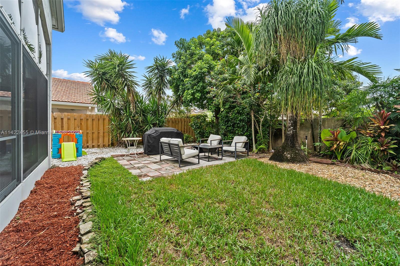 22699 Royal Crown Terrace East Boca Raton, FL 33433 - Photo 32 of 36 a view of a backyard with sitting area