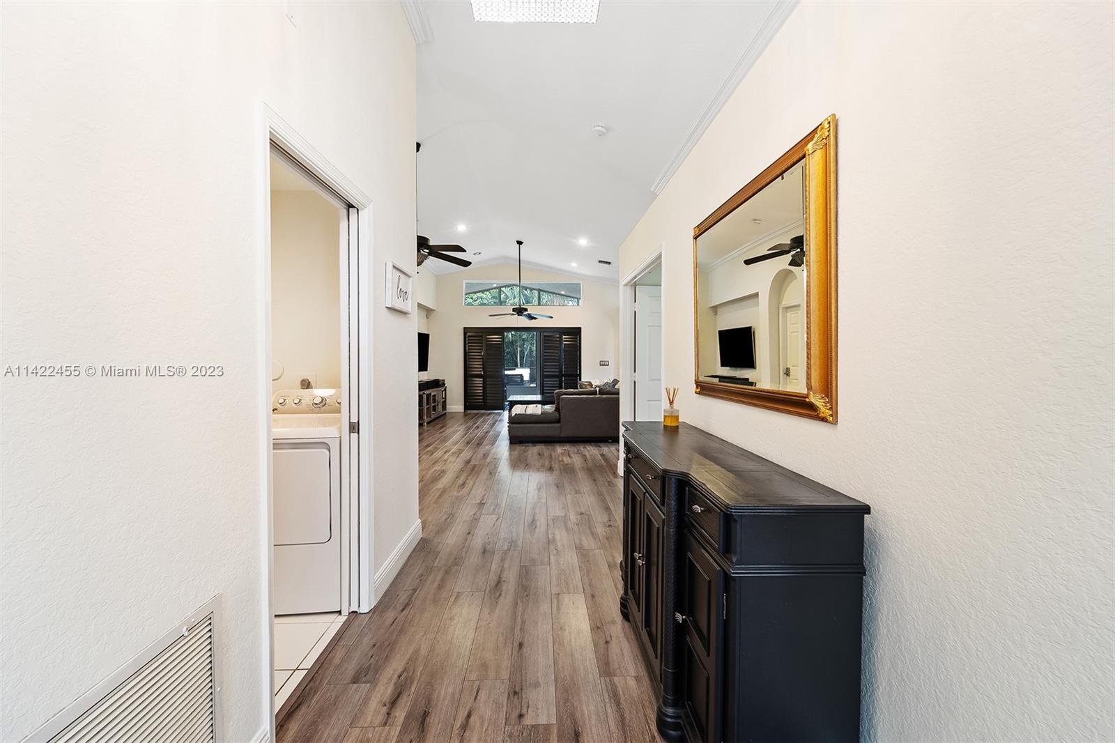 22699 Royal Crown Terrace East Boca Raton, FL 33433 - Photo 36 of 36 a living room with stainless steel appliances furniture a fireplace and wooden floor