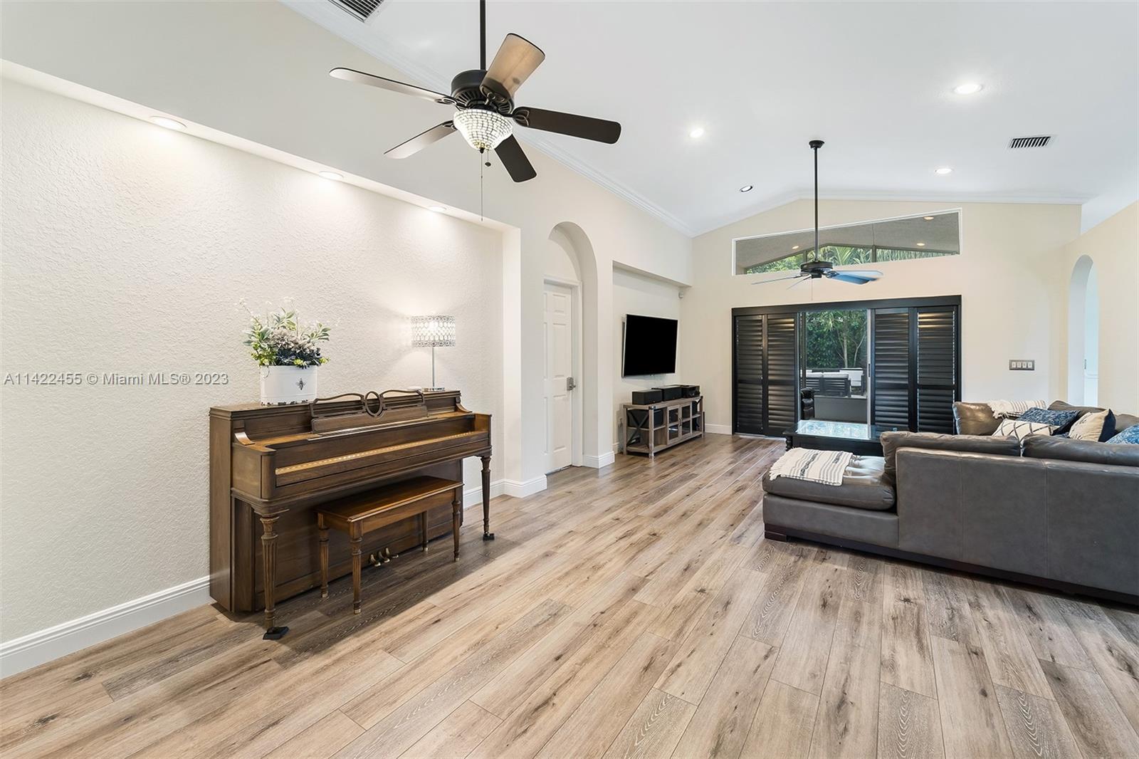 22699 Royal Crown Terrace East Boca Raton, FL 33433 - Photo 5 of 36 a living room with furniture and a wooden floor