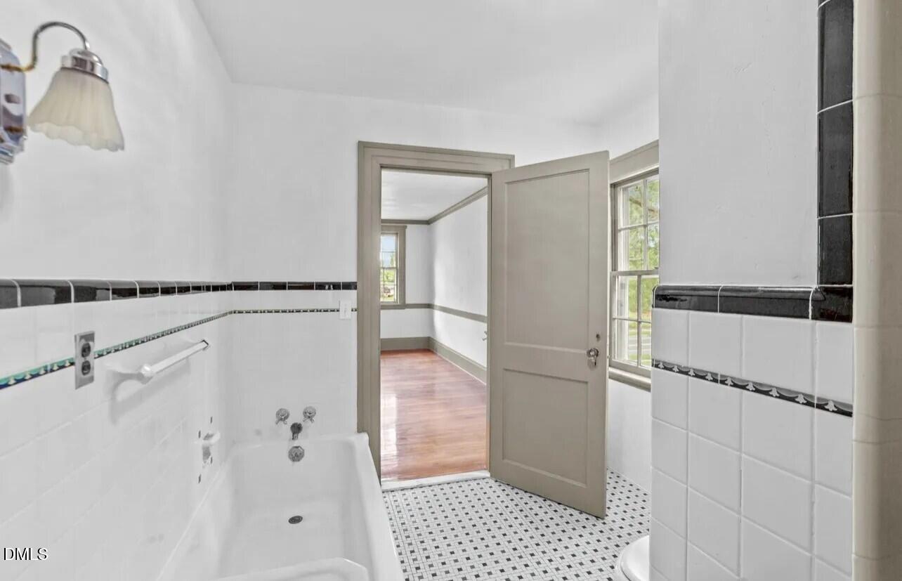 620 Falls Road Rocky Mount, NC 27804 - Photo 8 of 13 a bathroom with a shower and a sink