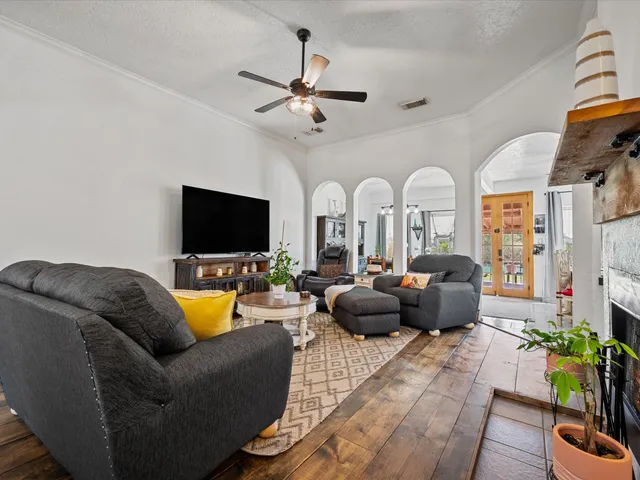 a living room with furniture and a flat screen tv
