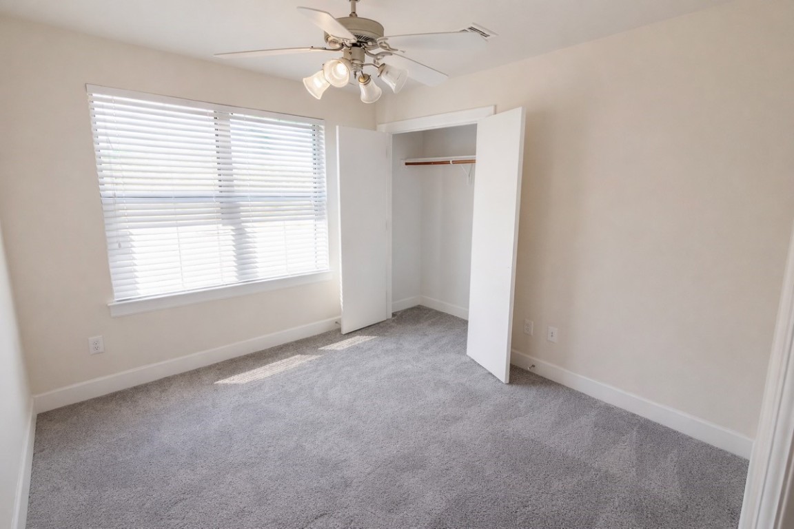 2710 Hullsmith Drive, Unit 803 Houston, TX 77063 - Photo 15 of 21 an empty room with windows and fan