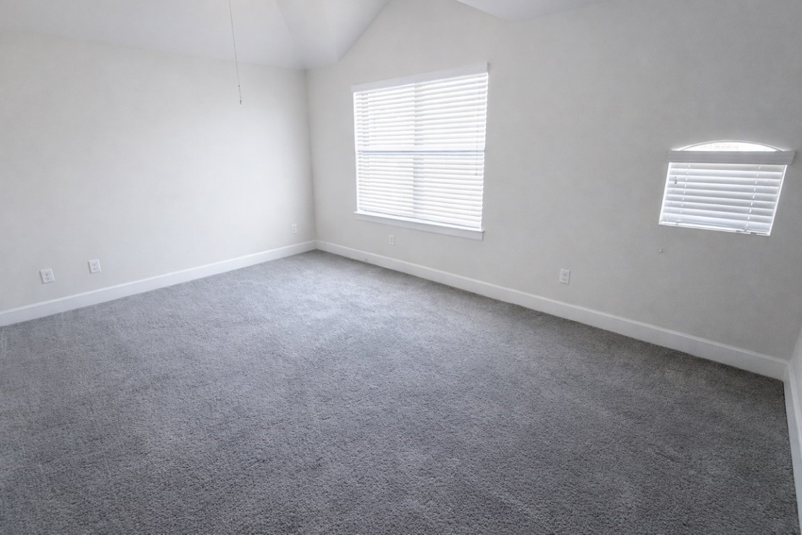 2710 Hullsmith Drive, Unit 803 Houston, TX 77063 - Photo 7 of 21 an empty room with windows