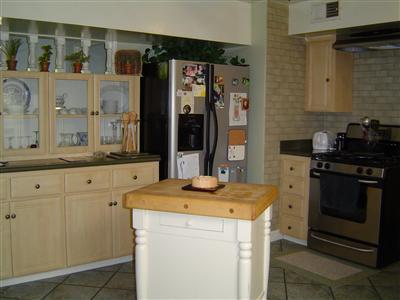 573 Gridley Road Ojai, CA 93023 - Photo 3 of 10 a kitchen with a stove and a sink