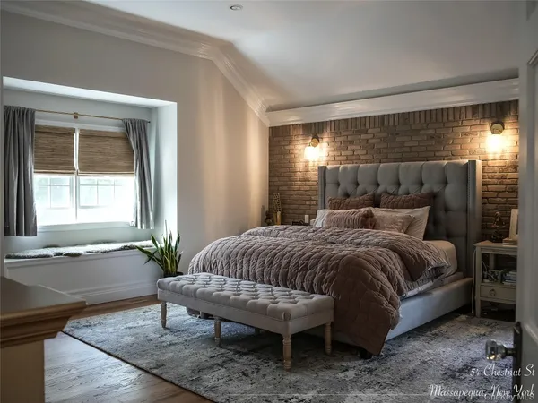 a spacious bedroom with a bed and window