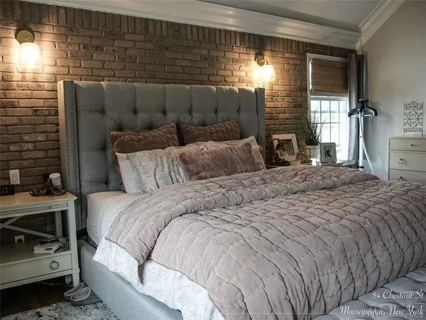 a bedroom with a bed and a mirror