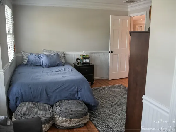 a bedroom with a bed and cabinets
