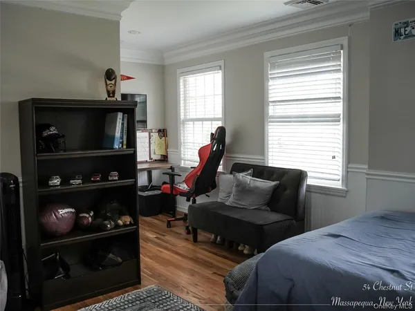 a living room with furniture a air conditioner and window