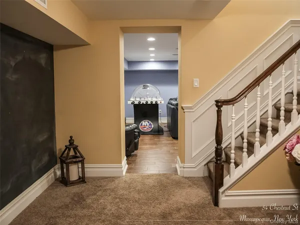 a view of a hallway with seating area