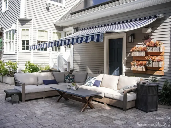 a outdoor living space with furniture and a potted plant