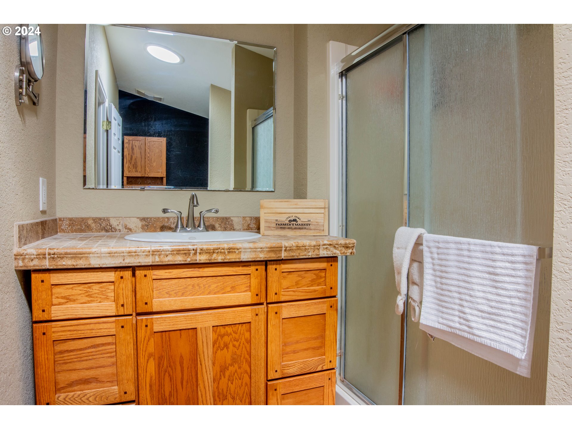 34221 Bond Road Lebanon, OR 97355 - Photo 17 of 45 a bathroom with a sink a vanity and a mirror