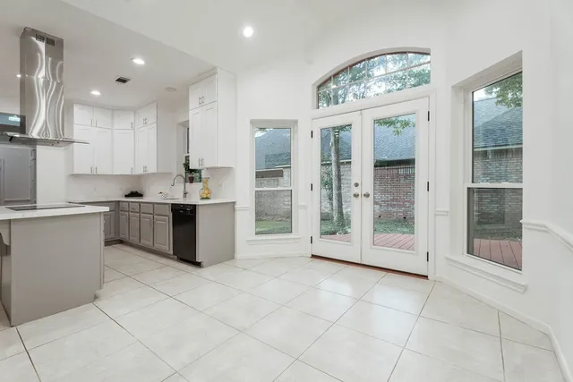 a view of a room with wooden floor and white walls