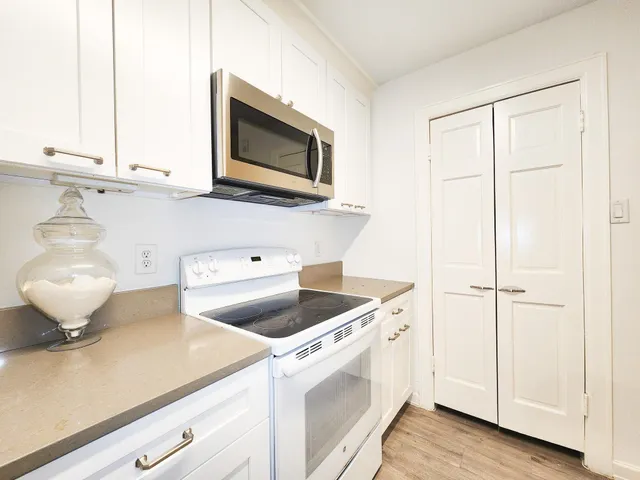 a kitchen with a sink and a microwave
