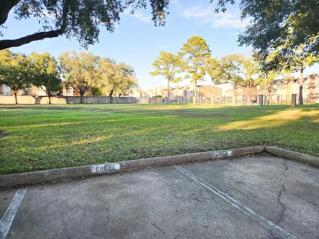 a view of a building with a small yard