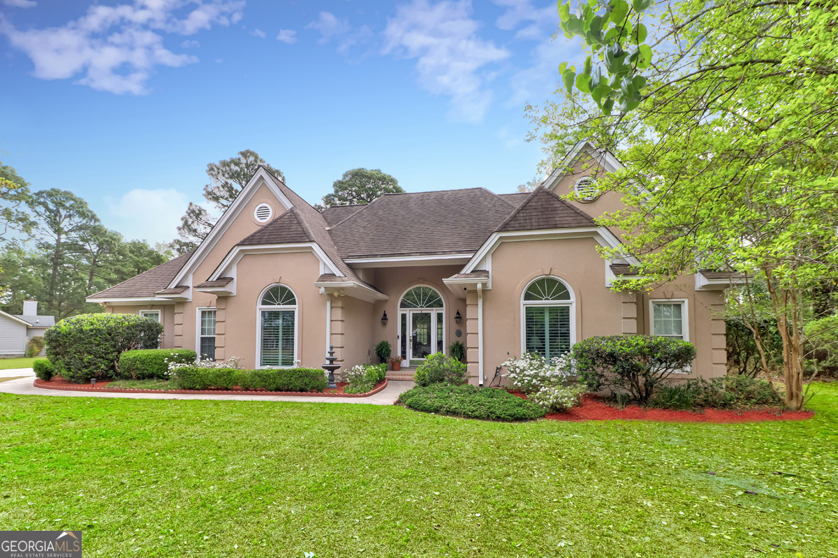 109 St Andrews Road Rincon, GA 31326 - Photo 2 of 52 a front view of a house with a garden