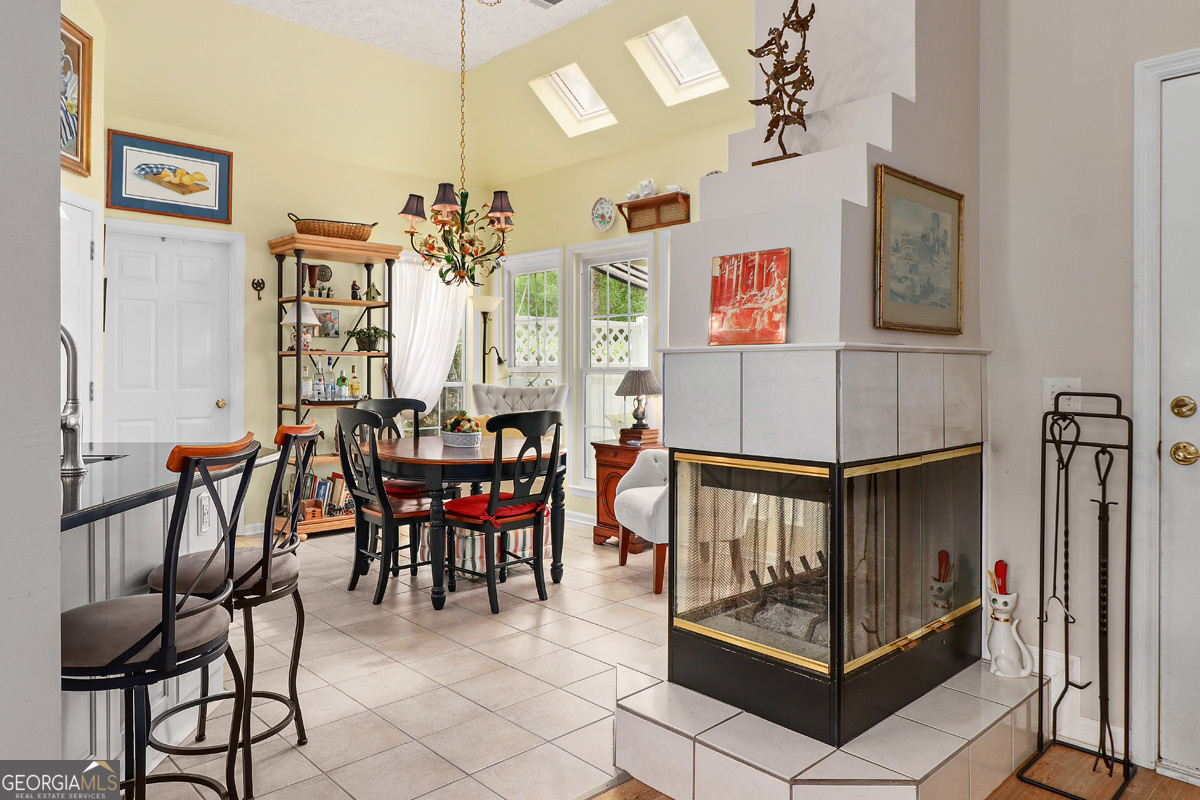 109 St Andrews Road Rincon, GA 31326 - Photo 25 of 52 a view of a dining room with furniture and a chandelier