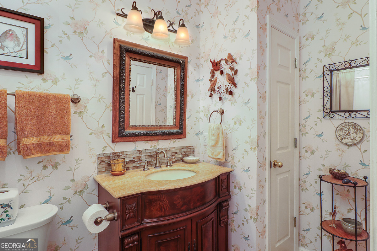 109 St Andrews Road Rincon, GA 31326 - Photo 32 of 52 a bathroom with a sink mirror and a shower