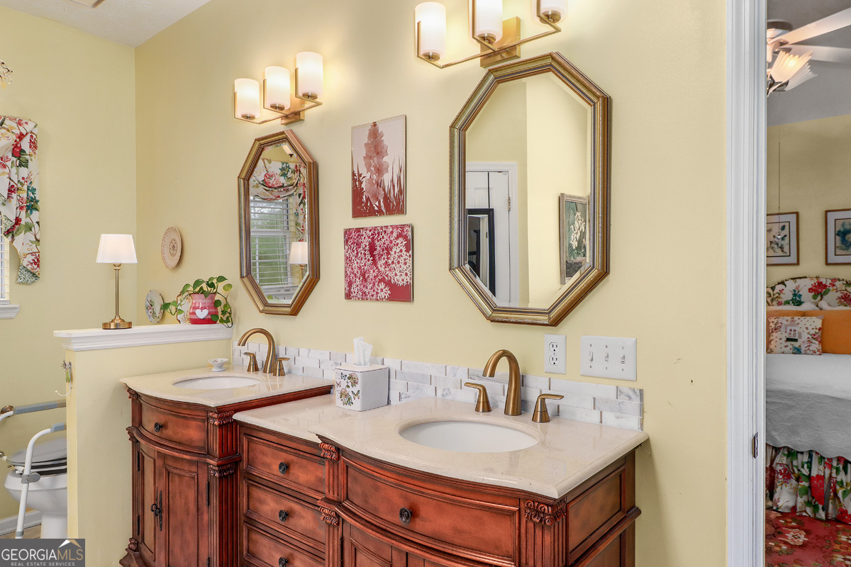 109 St Andrews Road Rincon, GA 31326 - Photo 39 of 52 a bathroom with a sink and a mirror