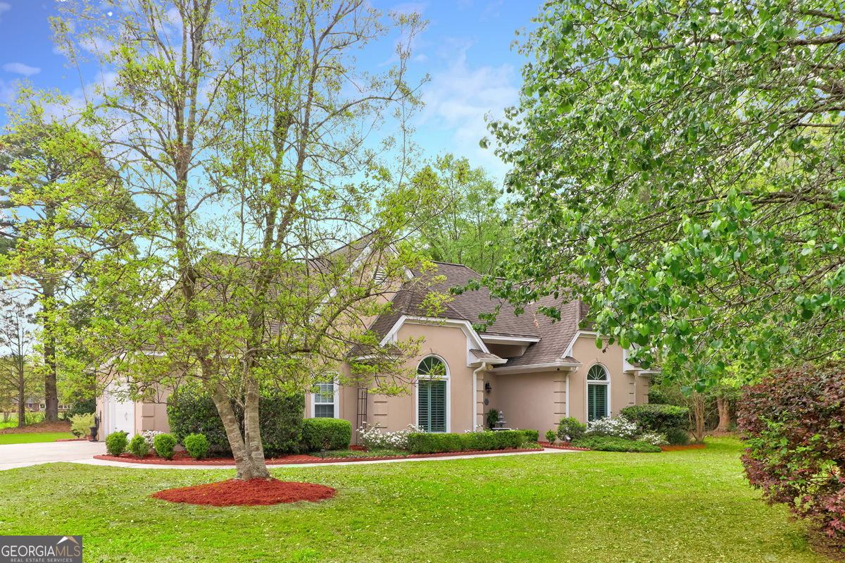 109 St Andrews Road Rincon, GA 31326 - Photo 4 of 52 a front view of house with yard and green space