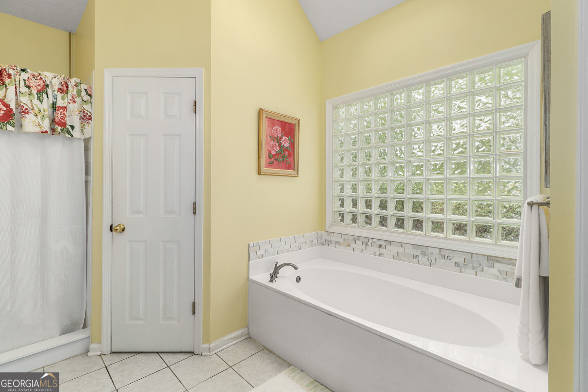 109 St Andrews Road Rincon, GA 31326 - Photo 41 of 52 a white bath tub sitting next to a window