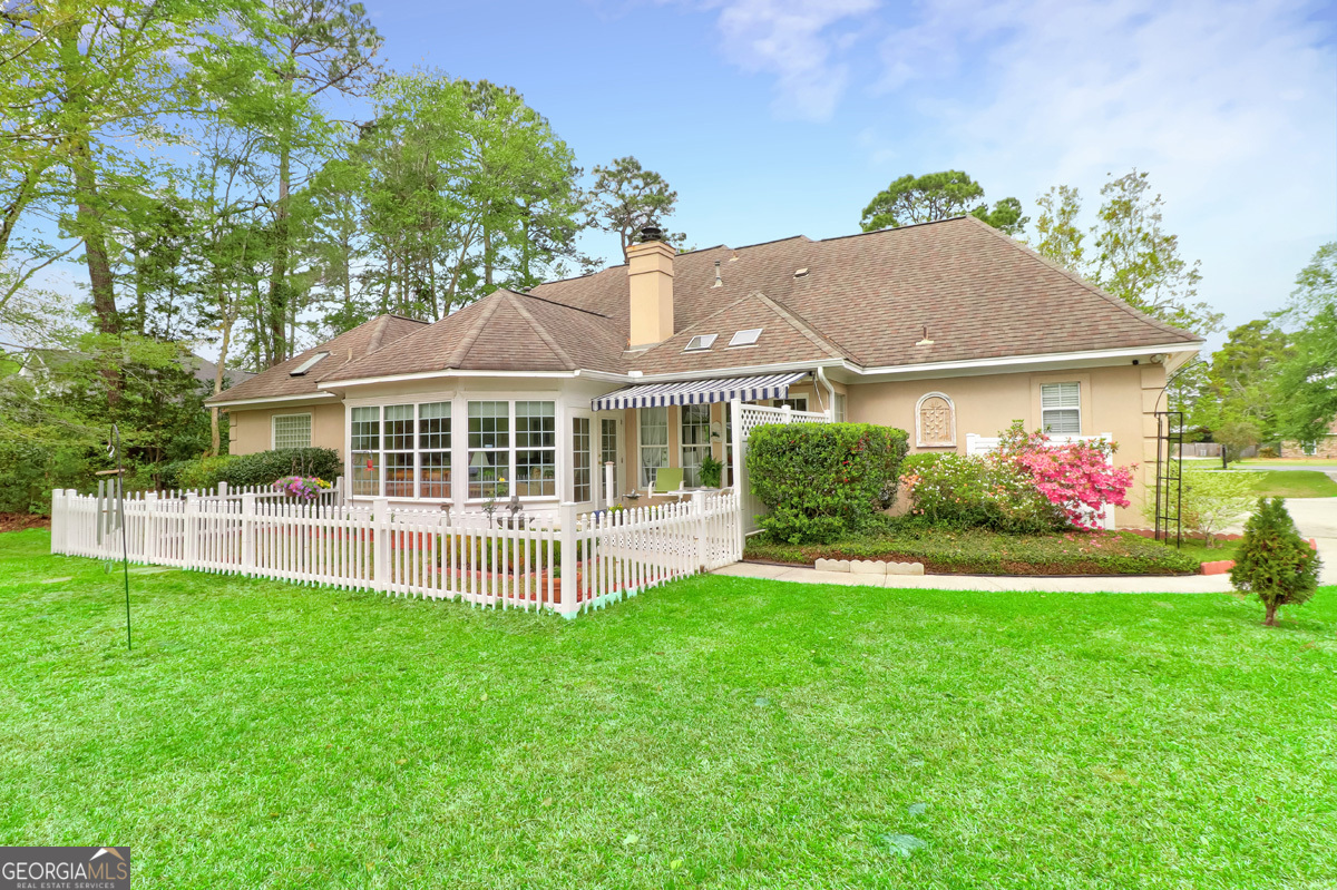 109 St Andrews Road Rincon, GA 31326 - Photo 47 of 52 a view of a house with a yard and sitting area