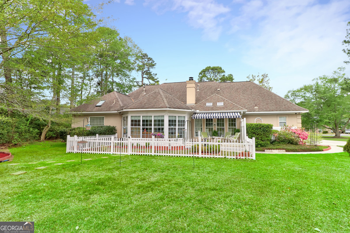 109 St Andrews Road Rincon, GA 31326 - Photo 48 of 52 a view of a house with a yard and sitting area