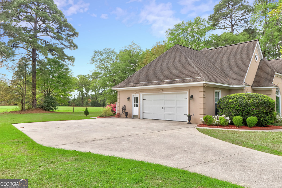 109 St Andrews Road Rincon, GA 31326 - Photo 5 of 52 a view of a house with a yard and garage