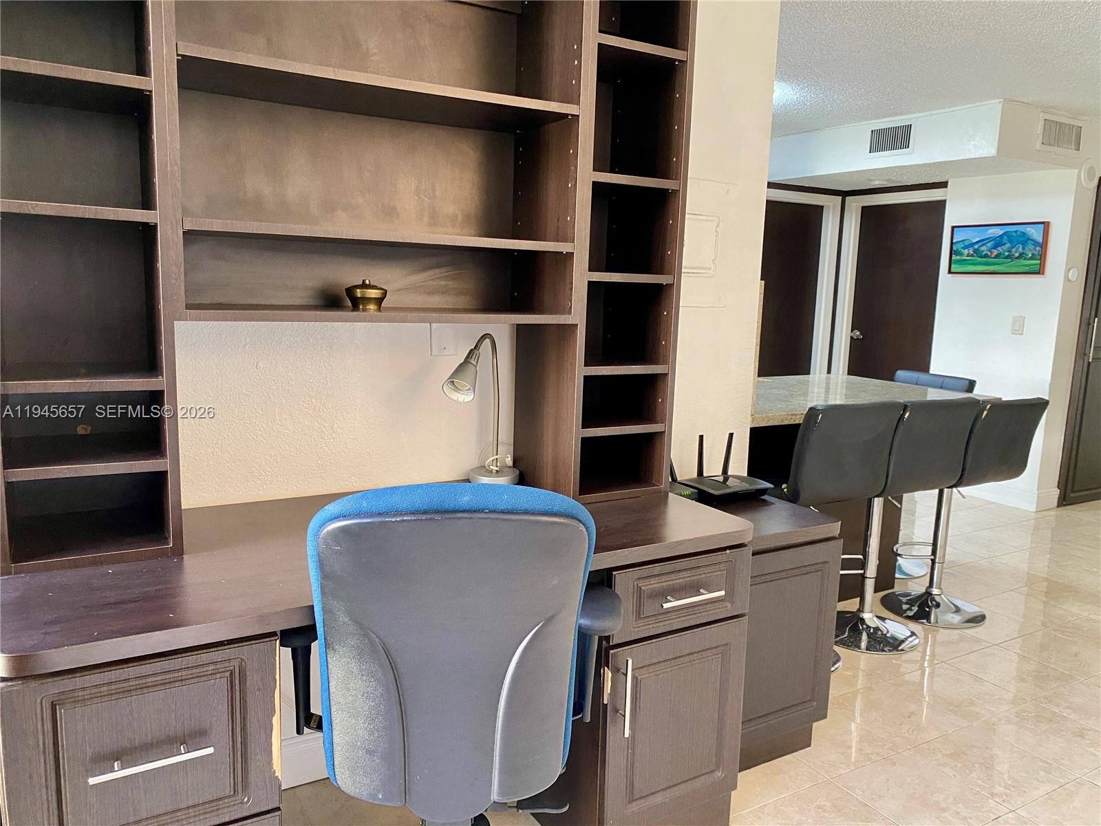 17011 North Bay Road, Unit 304 Sunny Isles Beach, FL 33160 - Photo 23 of 54 a kitchen with stainless steel appliances a refrigerator and a stove top oven