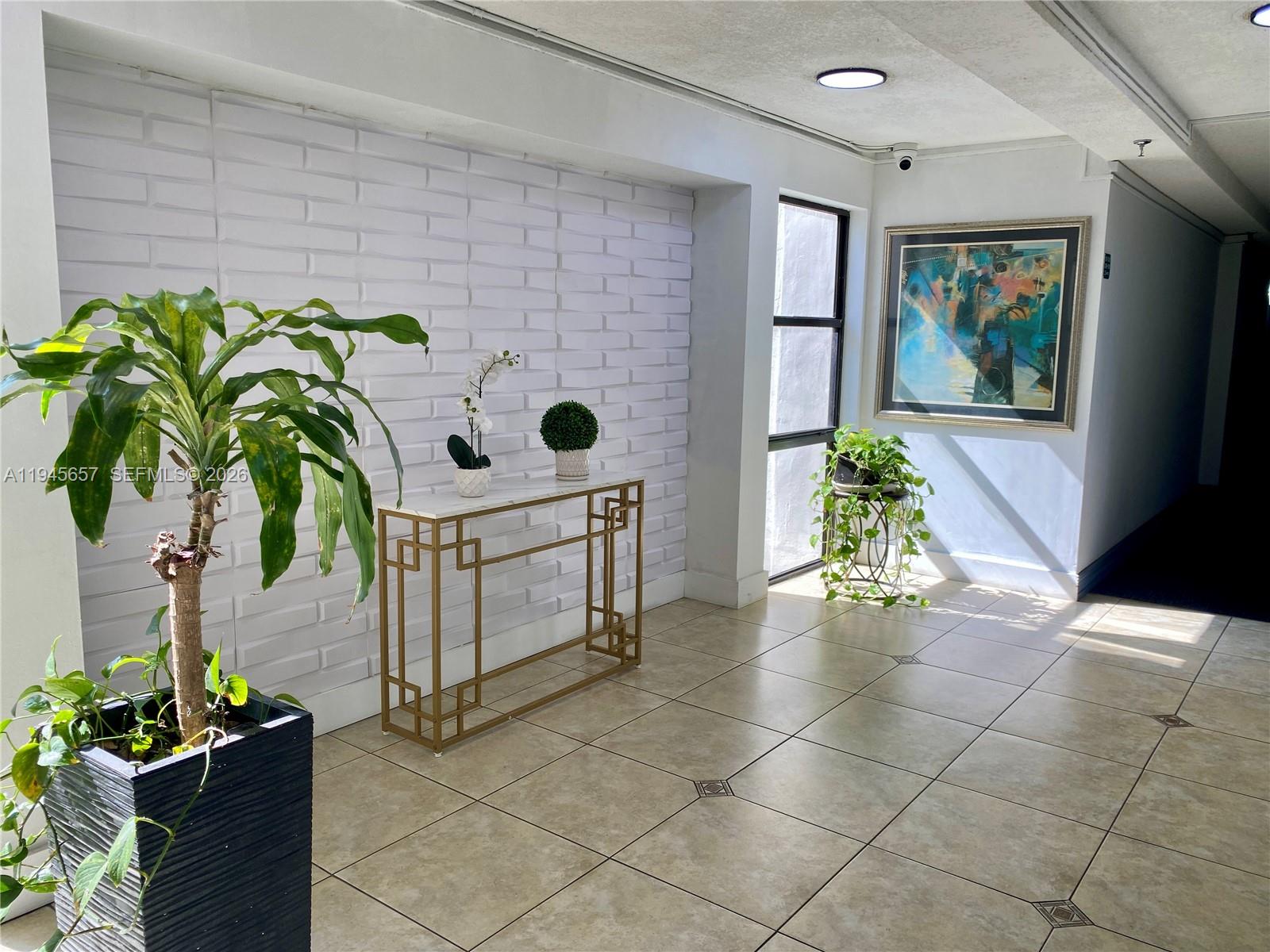 17011 North Bay Road, Unit 304 Sunny Isles Beach, FL 33160 - Photo 38 of 54 a view of entryway with paintings on the wall