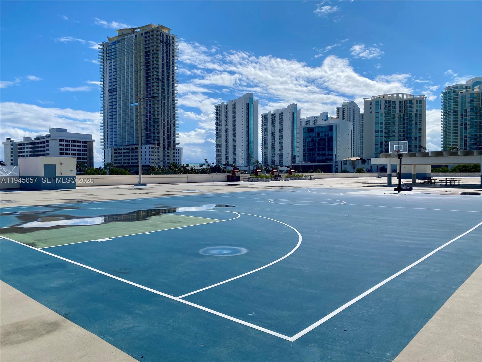 17011 North Bay Road, Unit 304 Sunny Isles Beach, FL 33160 - Photo 40 of 54 a view of a tennis court