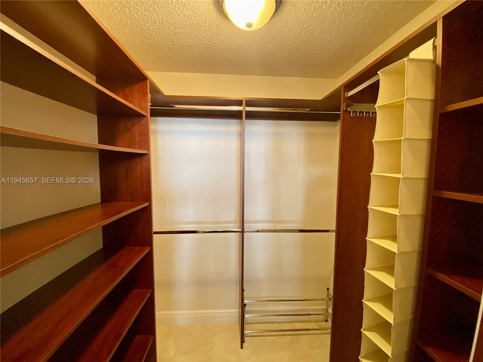 17011 North Bay Road, Unit 304 Sunny Isles Beach, FL 33160 - Photo 4 of 54 a bathroom with a glass door shower