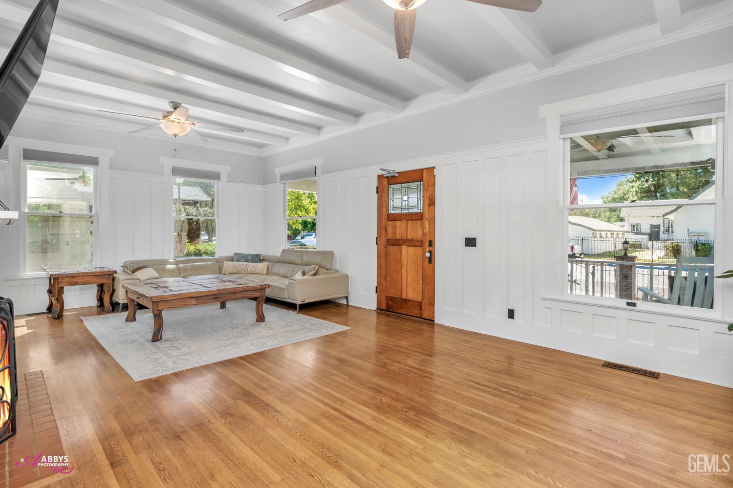 Undisclosed Address Bakersfield, CA 93301 - Photo 11 of 58 a living room with furniture and a wooden floor