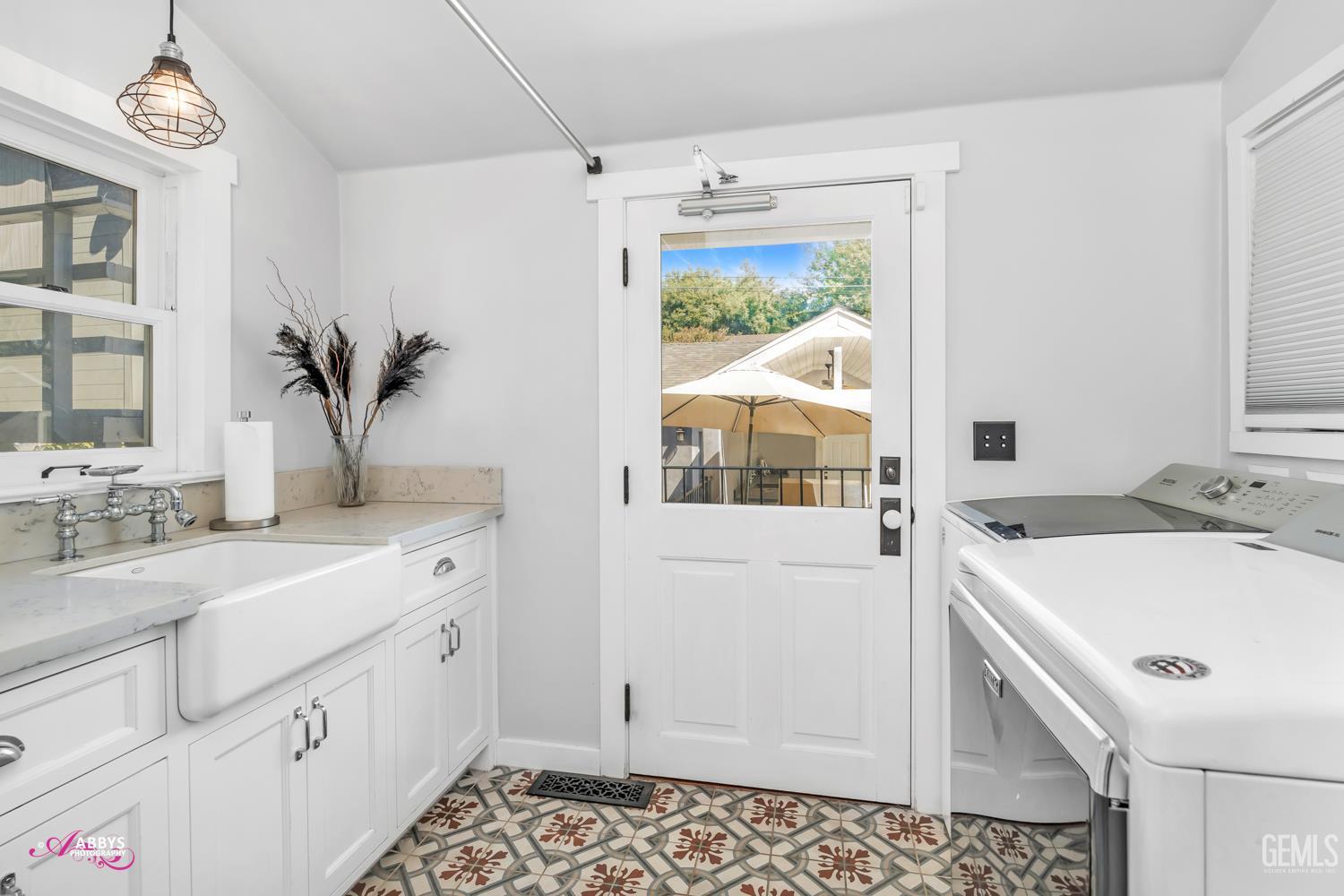 Undisclosed Address Bakersfield, CA 93301 - Photo 15 of 58 a bathroom with a sink a vanity and a mirror