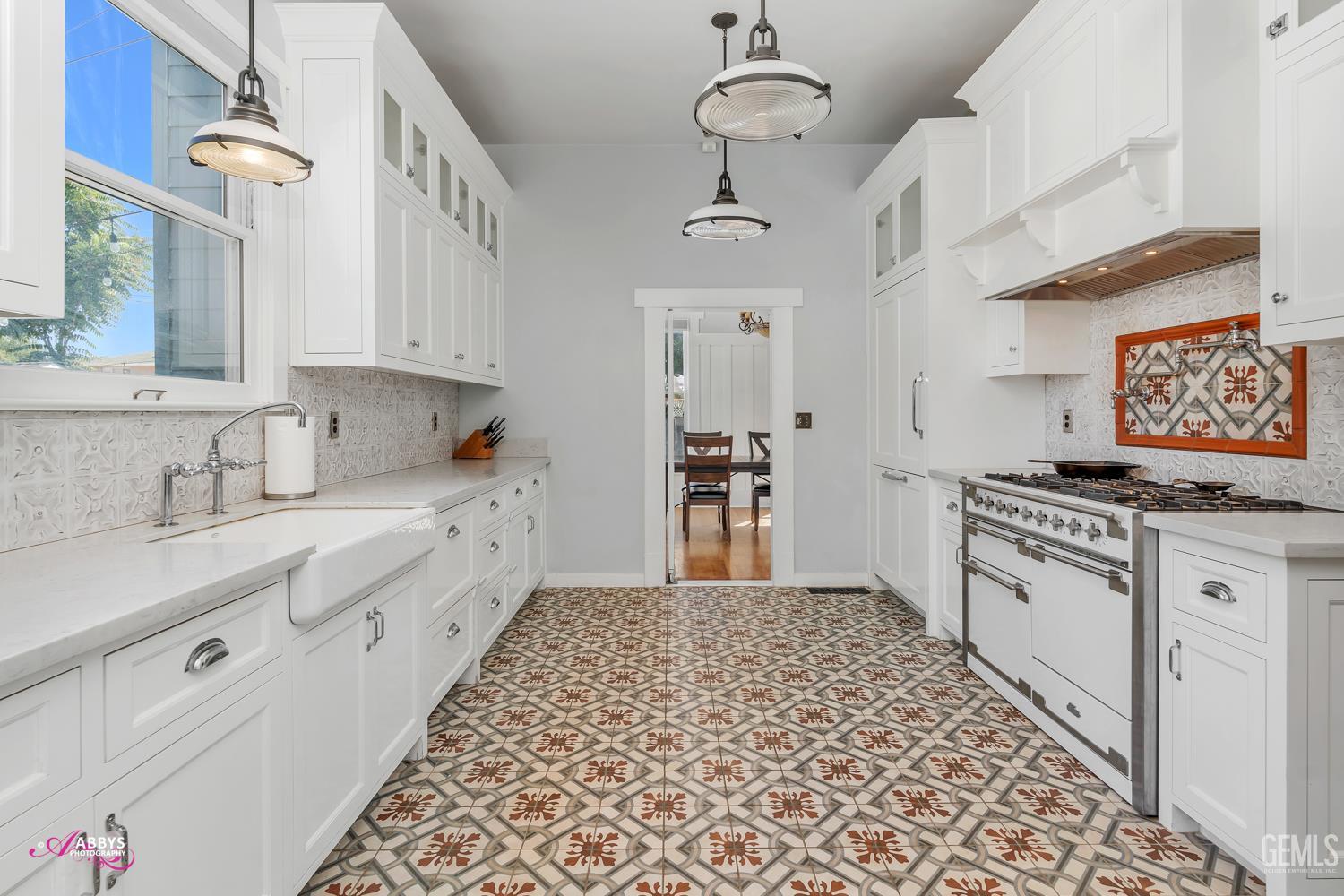 Undisclosed Address Bakersfield, CA 93301 - Photo 17 of 58 a kitchen with stainless steel appliances granite countertop a sink stove and refrigerator