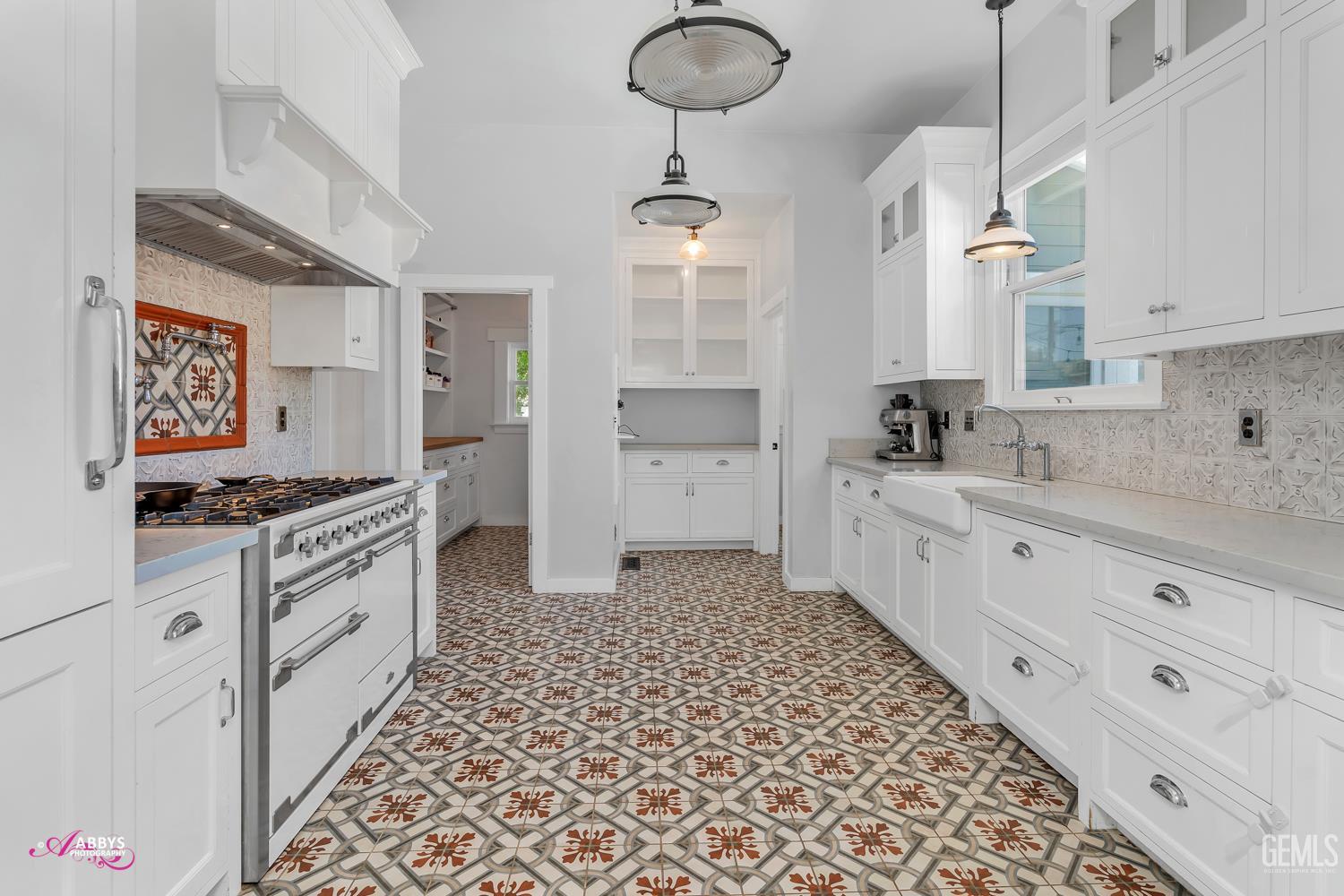 Undisclosed Address Bakersfield, CA 93301 - Photo 18 of 58 a kitchen with a sink cabinets and window