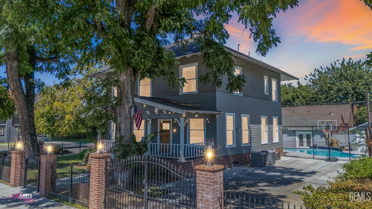 Undisclosed Address Bakersfield, CA 93301 - Photo 2 of 58 a front view of a house with garden