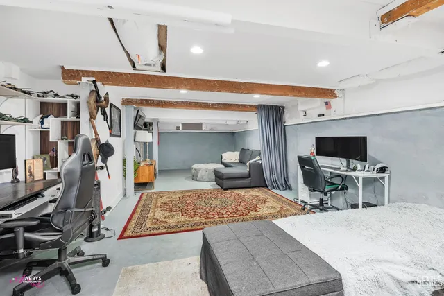 a bedroom with a bed and window