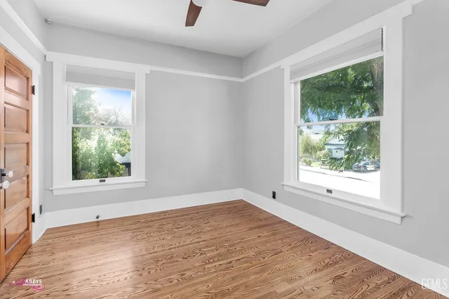 a view of a livingroom with furniture and an empty room